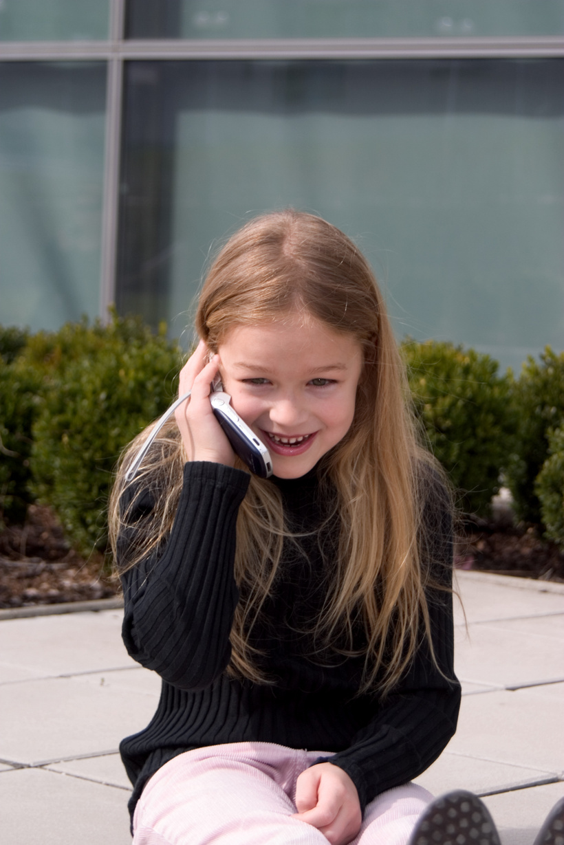 small girl on cell phone