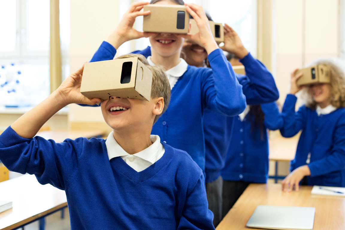 School kids using virtual reality goggles